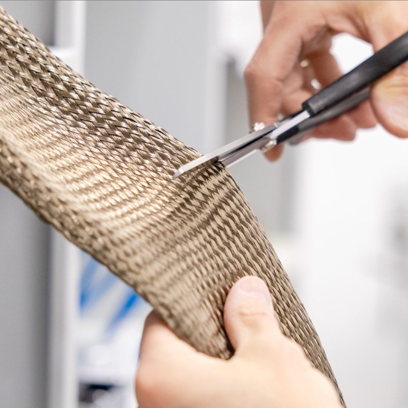 Cutting carbon material for the custom fabrication of a prosthesis